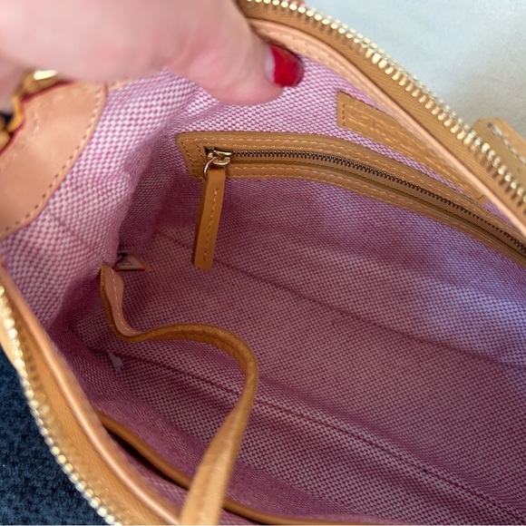 Dooney and Bourke Bag . Medium sized. Has imperfections . - Picture 11 of 17